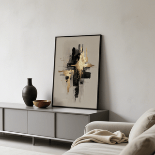 Black and gold poster leaning on a grey sideboard with a black vase and wooden bowl in a living room