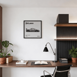 Modern Hybrid Hypercar Poster framed on a white wall above a desk with plants and a lamp