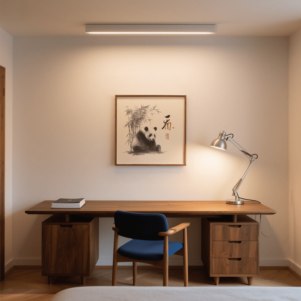 Panda Art Print on wall above wooden desk with a silver desk lamp in a warm room