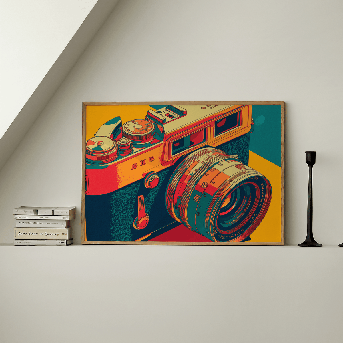 Vintage Camera wall art in pop-art style with orange teal and red tones on a shelf with a black candle holder