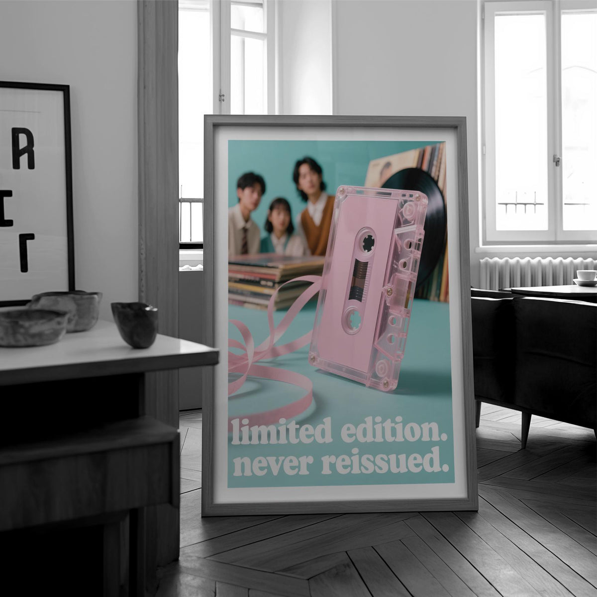 Framed close-up of Poster Vintage Music showing a pink audio cassette tape with text, beside modern living room furniture