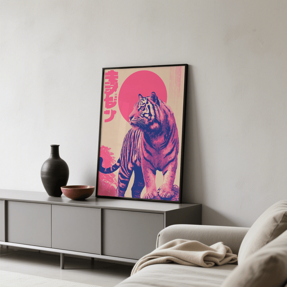 Framed Colorful Tiger Wall Art with pink and beige illustration leaning on a sideboard with a black vase