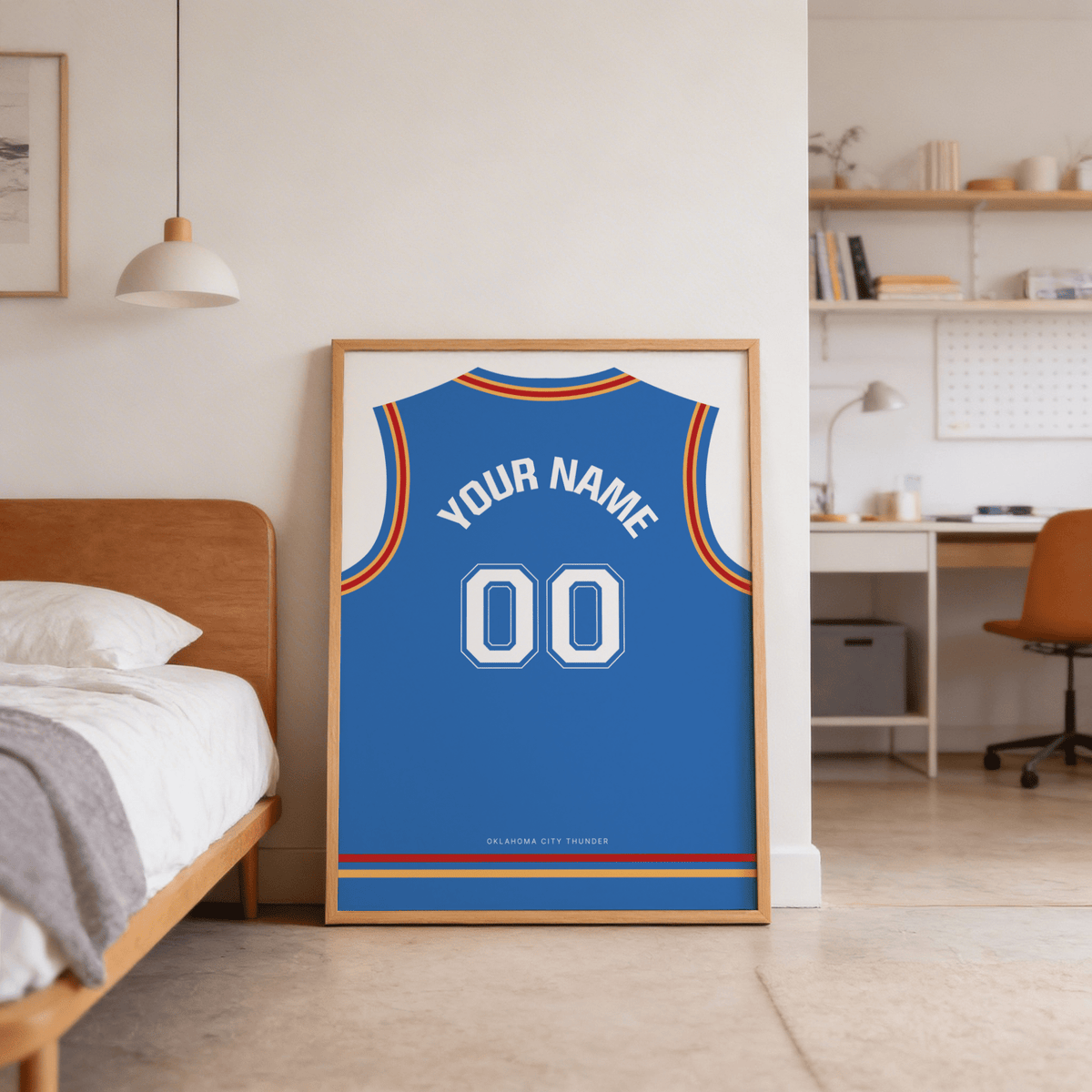 Basketball Jersey Poster in Blue with Red and Yellow Trim leaning on floor beside a wooden bed