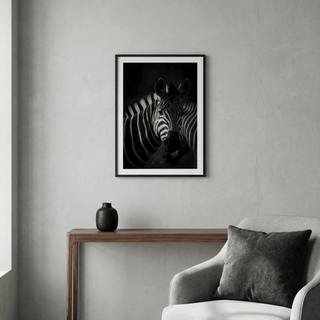 Framed Zebra Black White Print with photographic zebra portrait above a wooden console with a small black vase
