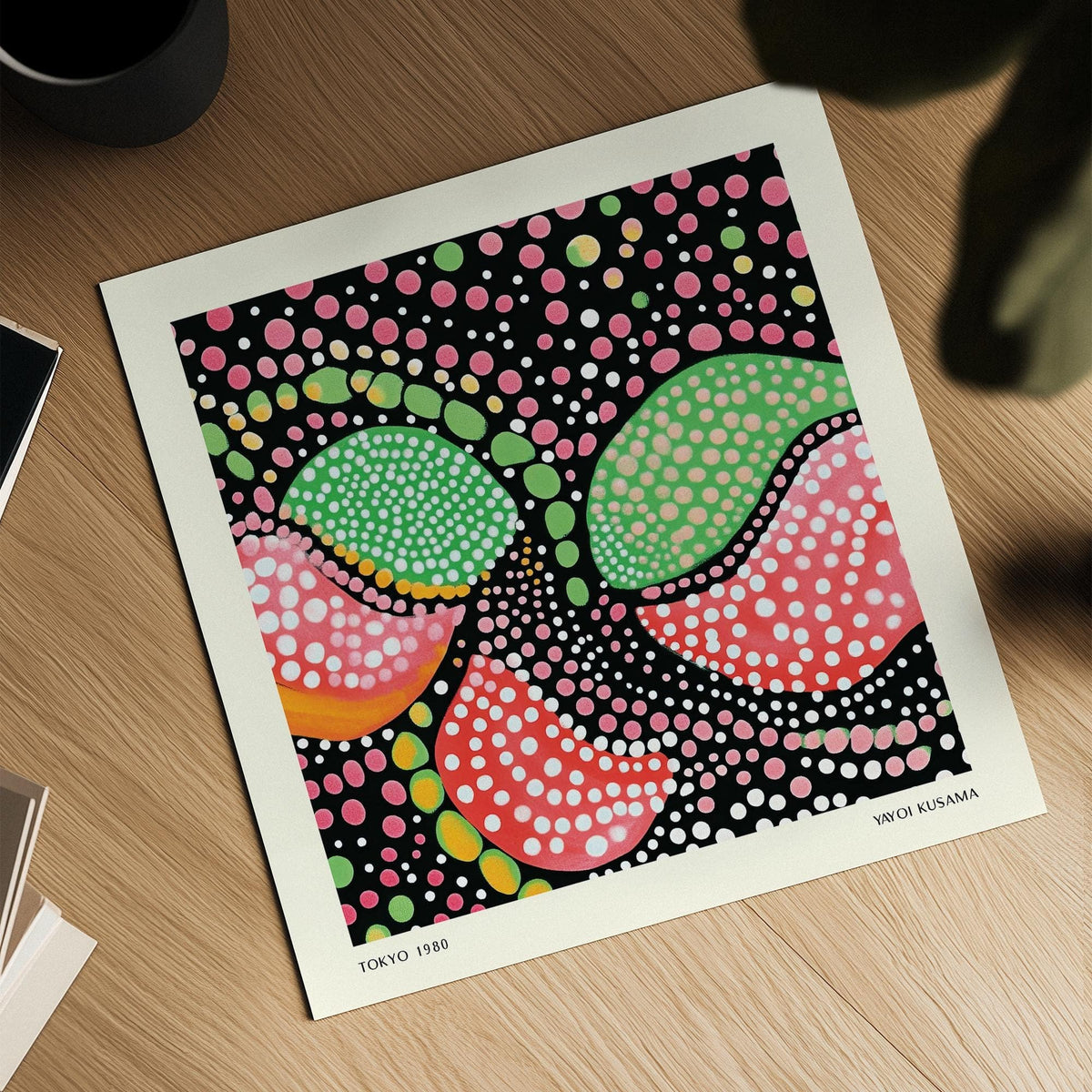 Detail close-up of abstract colourful fruit shapes with green and pink dots on a wooden surface