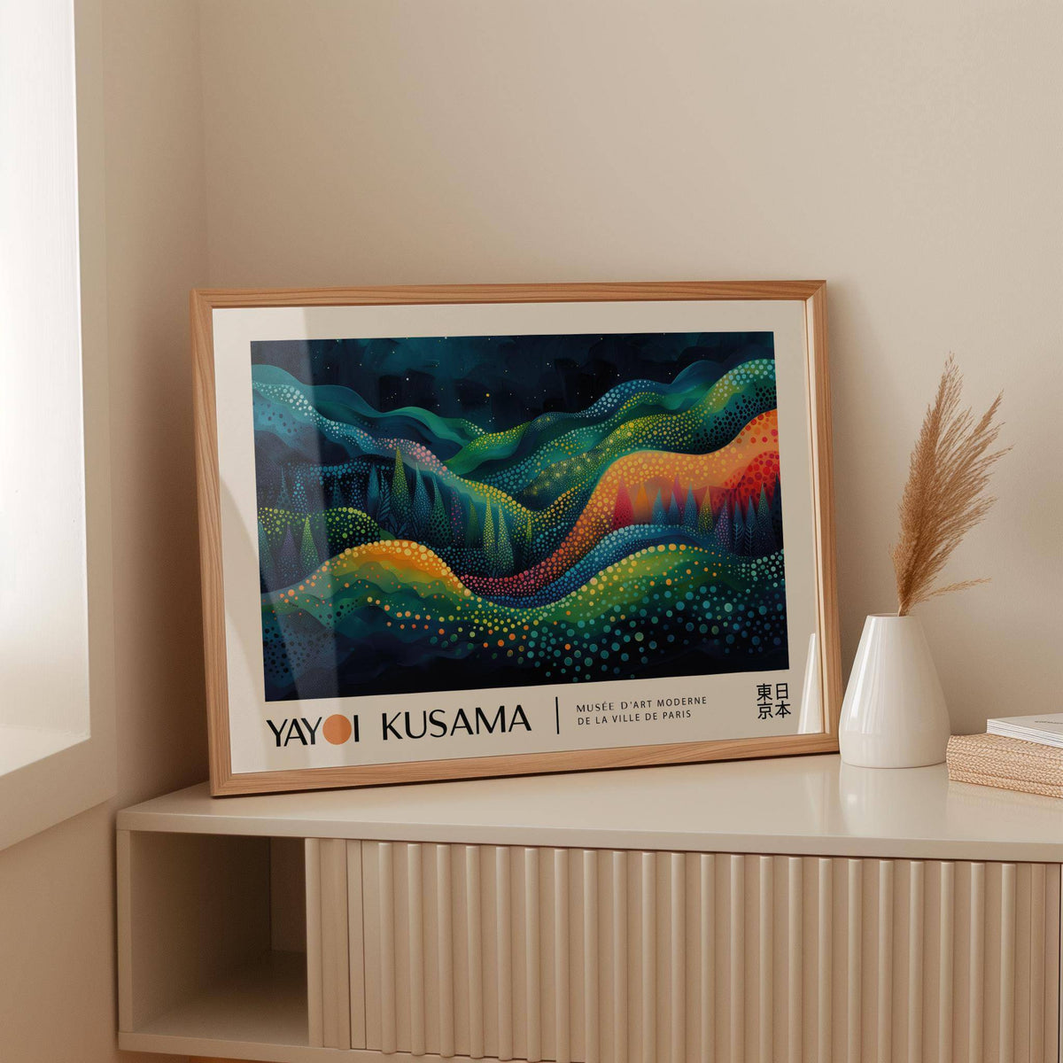 Horizontal Abstract Art framed print of colorful abstract waves leaning on a beige storage unit with a white vase
