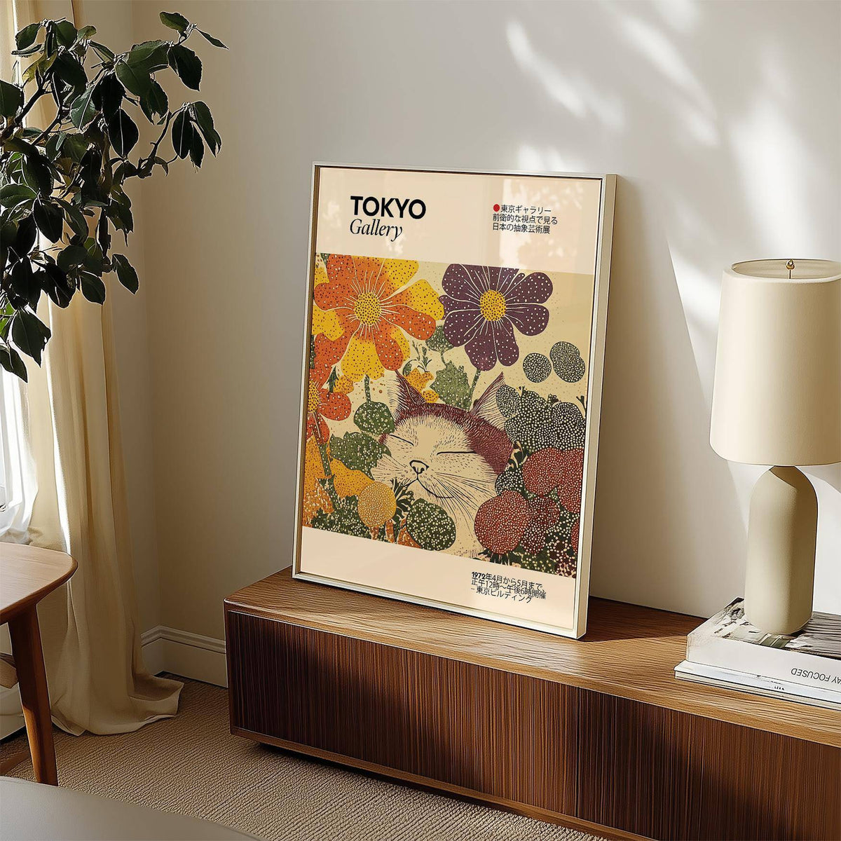Japanese artwork print leaning on a wooden sideboard with a lamp and plant in the room