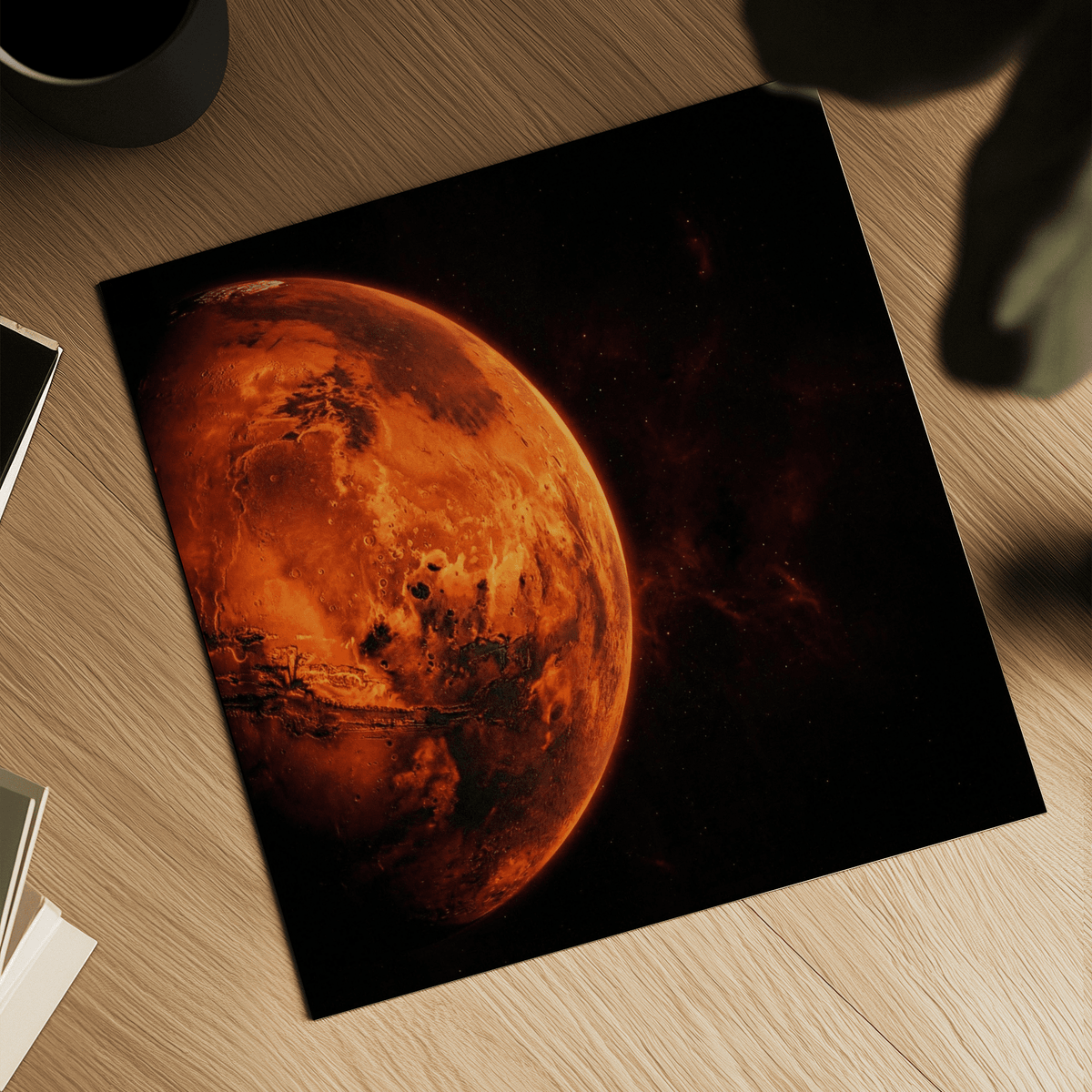Mars wall art photographic illustration of planet Mars on a wooden surface beside a mug