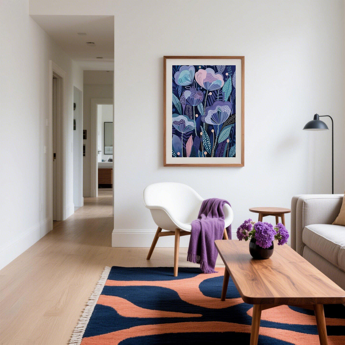 Purple Flower Poster on a living room wall with a white chair and a purple throw nearby