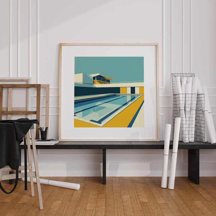 Minimalistic Art print of a swimming pool in yellow and blue on a black bench with rolled papers nearby