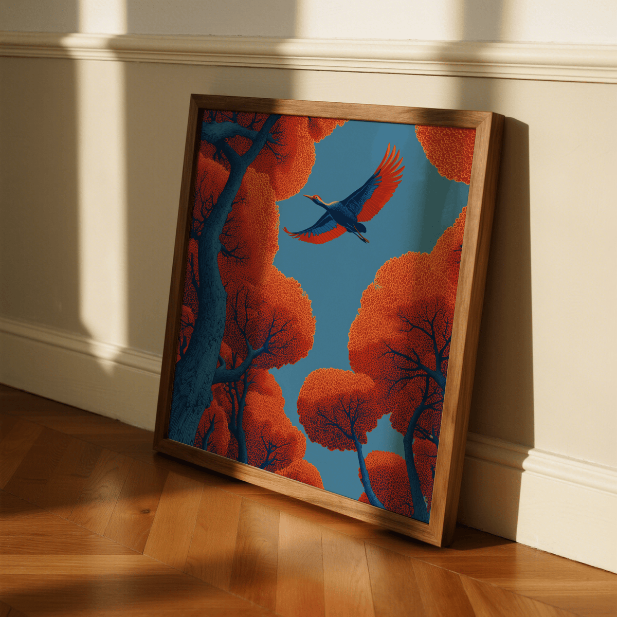 Fyling Bird wall decor with blue and orange hues leaning on a wooden floor near a cream wall