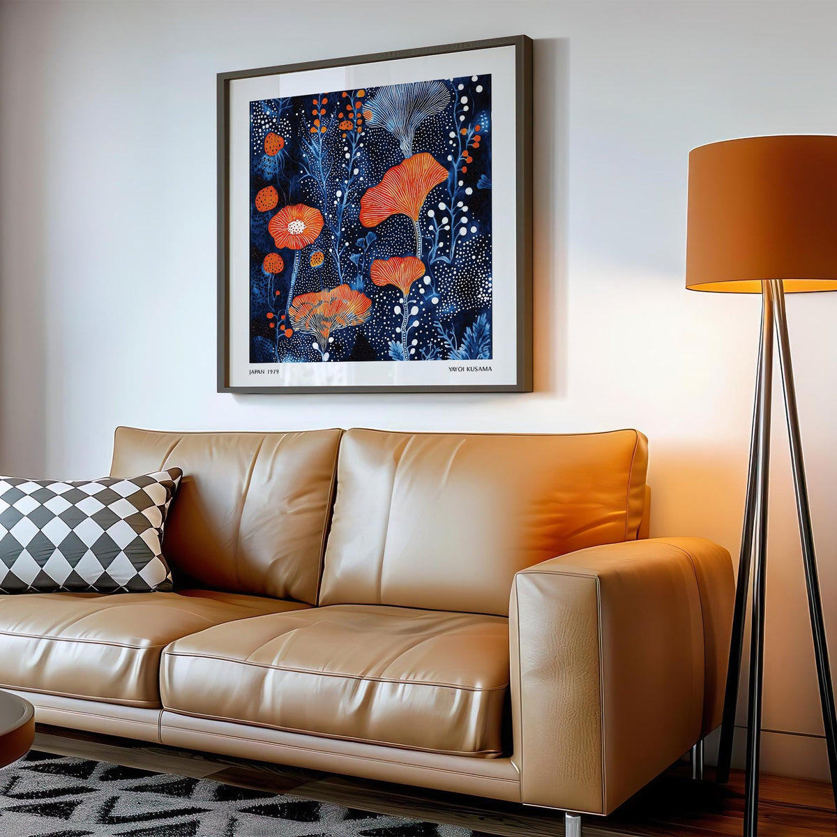 Abstract Flower Art framed print with coral and white dots above a leather sofa in a living room
