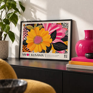 Floral Landscape Paintings, a small A4 framed print leaning on a black sideboard in a living room