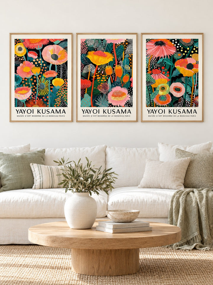 Floral Prints Set of 3 hung at eye level above a white linen sofa: Petal Paradise, Lush Tropica and Botanical Glow shown framed side by side (frames not included)