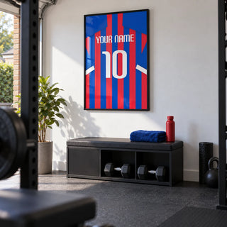 Football Shirt Poster in Blue and Red Stripes, framed on the wall of a small converted garage home gym in a UK house