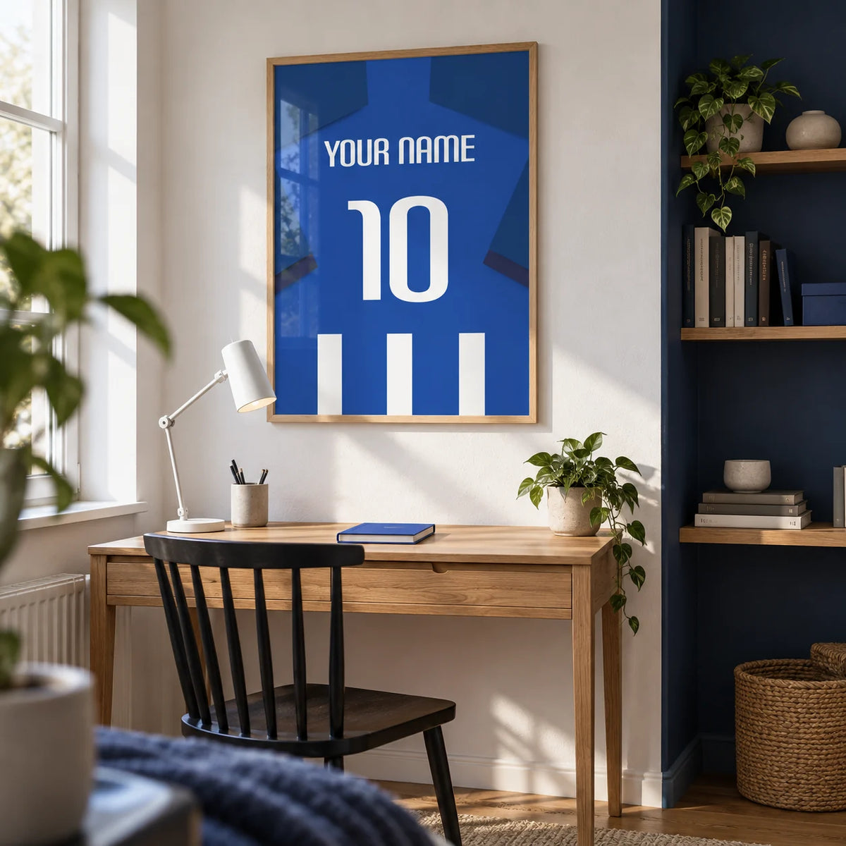 Football Shirt Poster in Blue and White Stripes with Dark Blue Sleeves, framed on the wall of a bright home study in a young adult football fan’s UK terrace