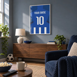 Football Shirt Poster in Blue and White Stripes with Dark Blue Sleeves, framed on the wall of a dedicated football-watching snug in a UK semi-detached home with a muted blue-grey wall in a living room