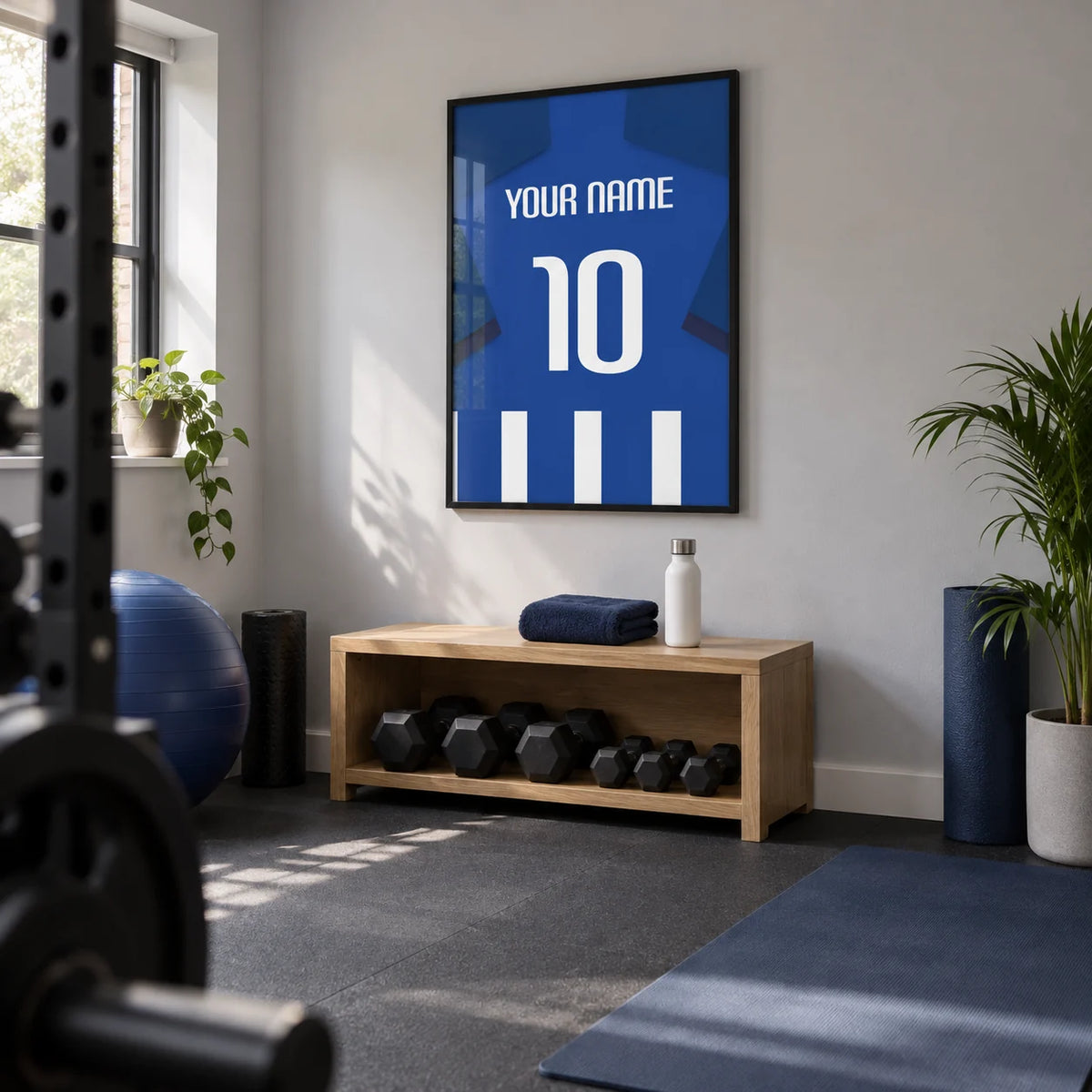 Football Shirt Poster in Blue and White Stripes with Dark Blue Sleeves, framed on the wall of a small converted spare-room home gym in a UK house with pale grey walls and plain dark rubber flooring