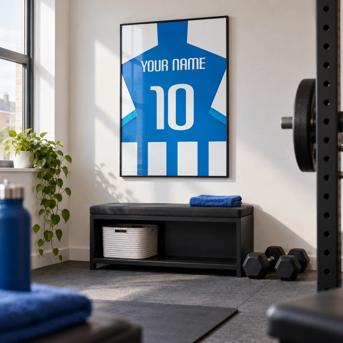 Football Shirt Poster in Blue and White Stripes with Striped Sleeves, framed on the wall of a compact home gym in a converted UK spare room with white walls and plain grey rubber flooring