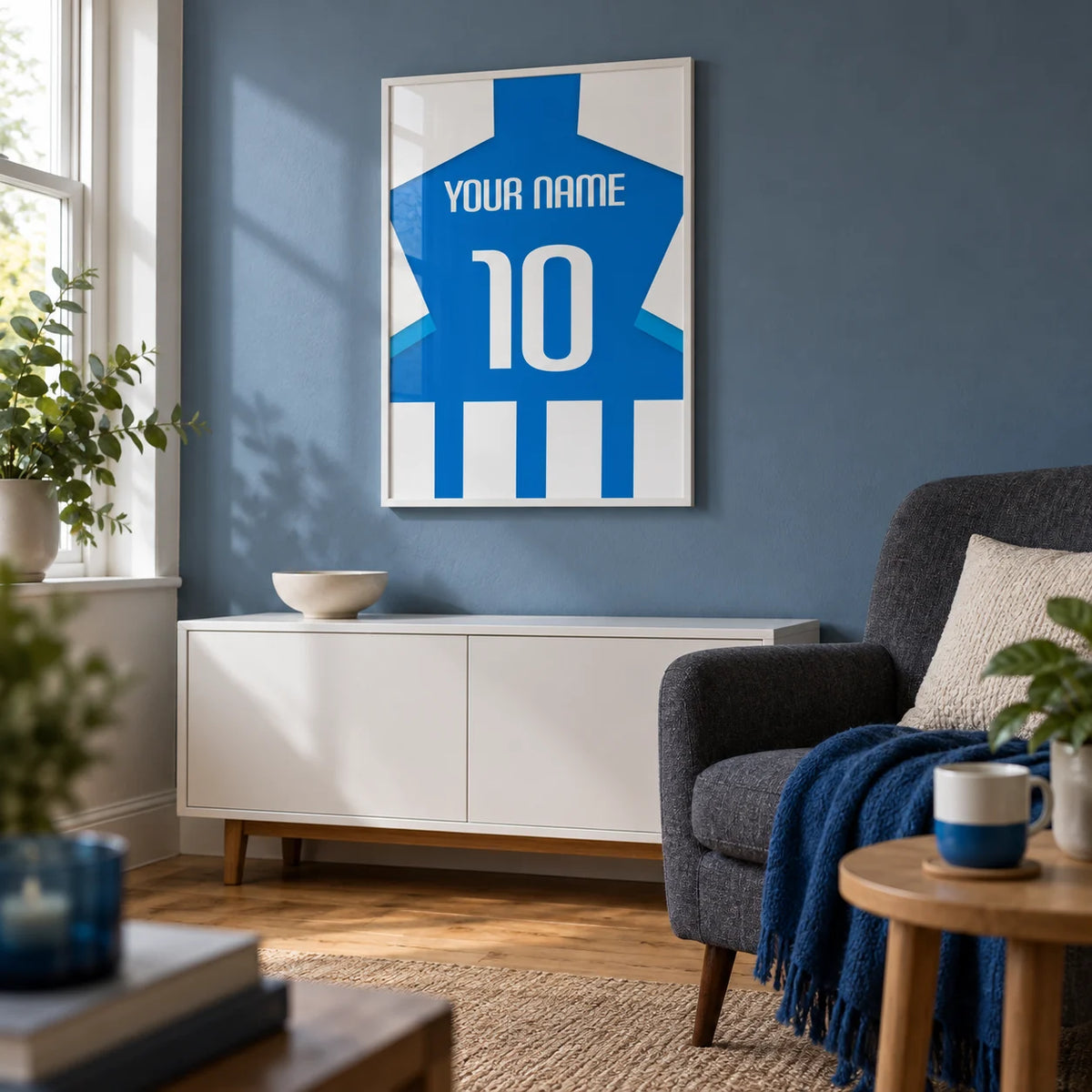 Football Shirt Poster in Blue and White Stripes with Striped Sleeves, framed on the wall of a small football matchday snug in a UK terraced house with a muted blue wall and oak floor in a living room