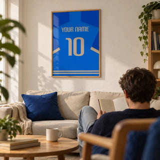 Football Shirt Poster in Blue with Beige Number, framed on the wall of a modern first-flat living room for a football fan (22-28) with an off-white wall and a low oak coffee table