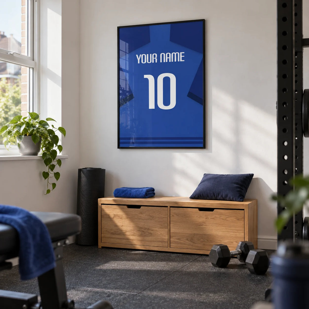 Football Shirt Poster in Blue with Dark Blue Sleeves and White Number, framed on the wall of a tidy home gym in a converted spare room of a British terraced house with white walls and charcoal rubber flooring