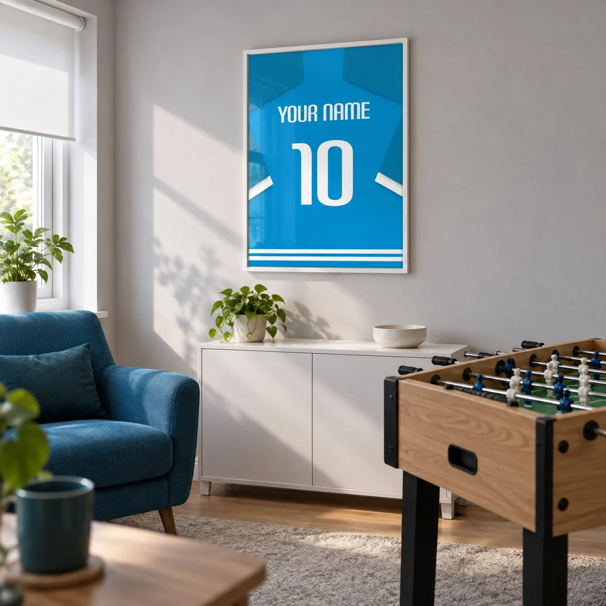Football Shirt Poster in Bright Blue with White Number, framed on the wall of a small converted spare-room games lounge in a UK home with a pale grey wall