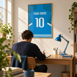 Football Shirt Poster in Bright Blue with White Number, framed on the wall of a tidy young adult's home study (22-35) with a warm white wall