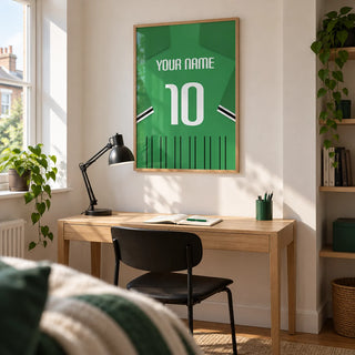 Football Shirt Poster in Green with Black and White Sleeve Stripes, framed on the wall of a bright home study for a young adult football fan in a UK terrace