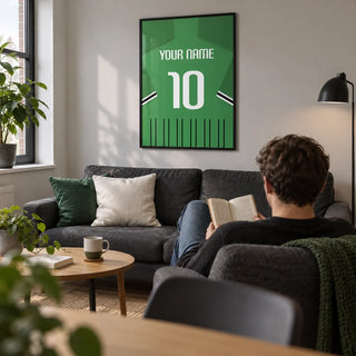 Football Shirt Poster in Green with Black and White Sleeve Stripes, framed on the wall of a compact modern living room in a football fan's first UK flat (22-28)
