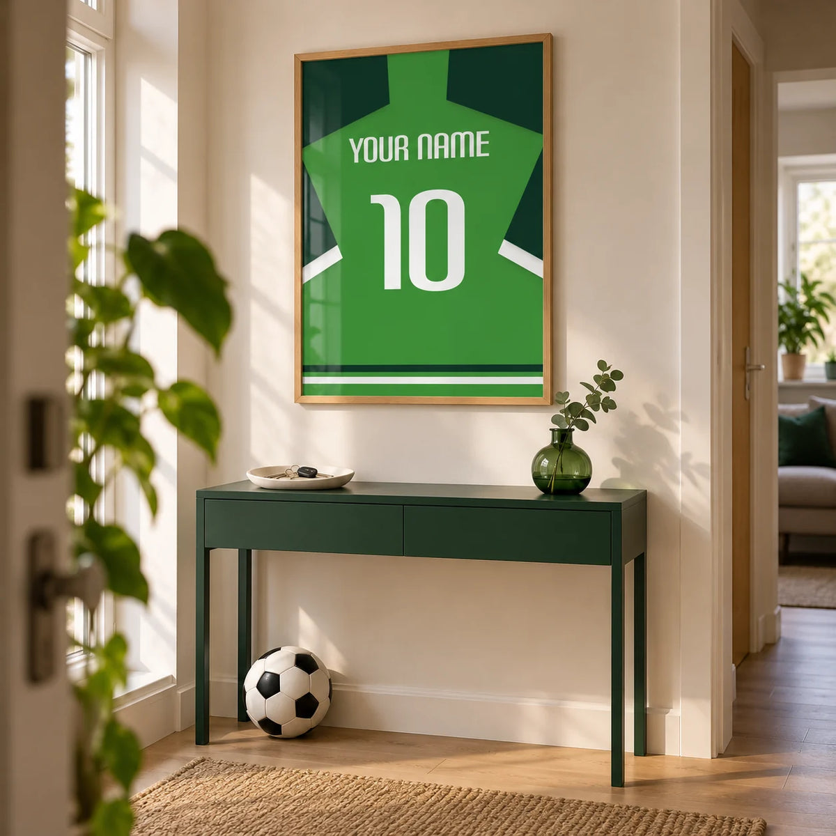 Football Shirt Poster in Green with Dark Green Sleeves, framed on the wall of a bright entrance hallway in a young football fan's UK flat (22-30) with a warm white wall and pale oak floor