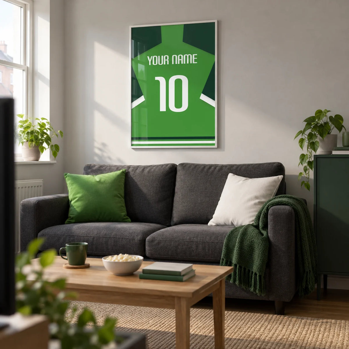 Football Shirt Poster in Green with Dark Green Sleeves, framed on the wall of a contemporary football-watching snug in a UK terraced house with a pale grey wall in a living room