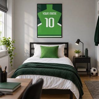 Football Shirt Poster in Green with Dark Green Sleeves, framed on the wall of a modern football-loving teenager's single bedroom (13-17) in a UK family home with a pale grey wall and oak floor