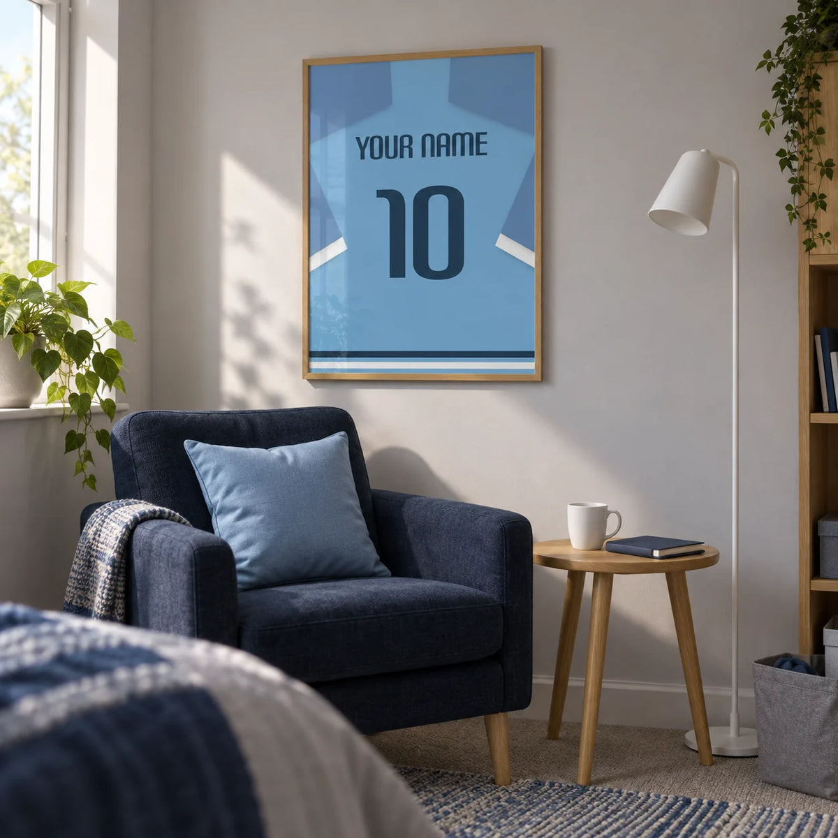 Football Shirt Poster in Light Blue with Dark Blue Number, framed on the wall of a compact sitting corner in a football fan's UK university room (18-21) with a pale grey wall in a living room