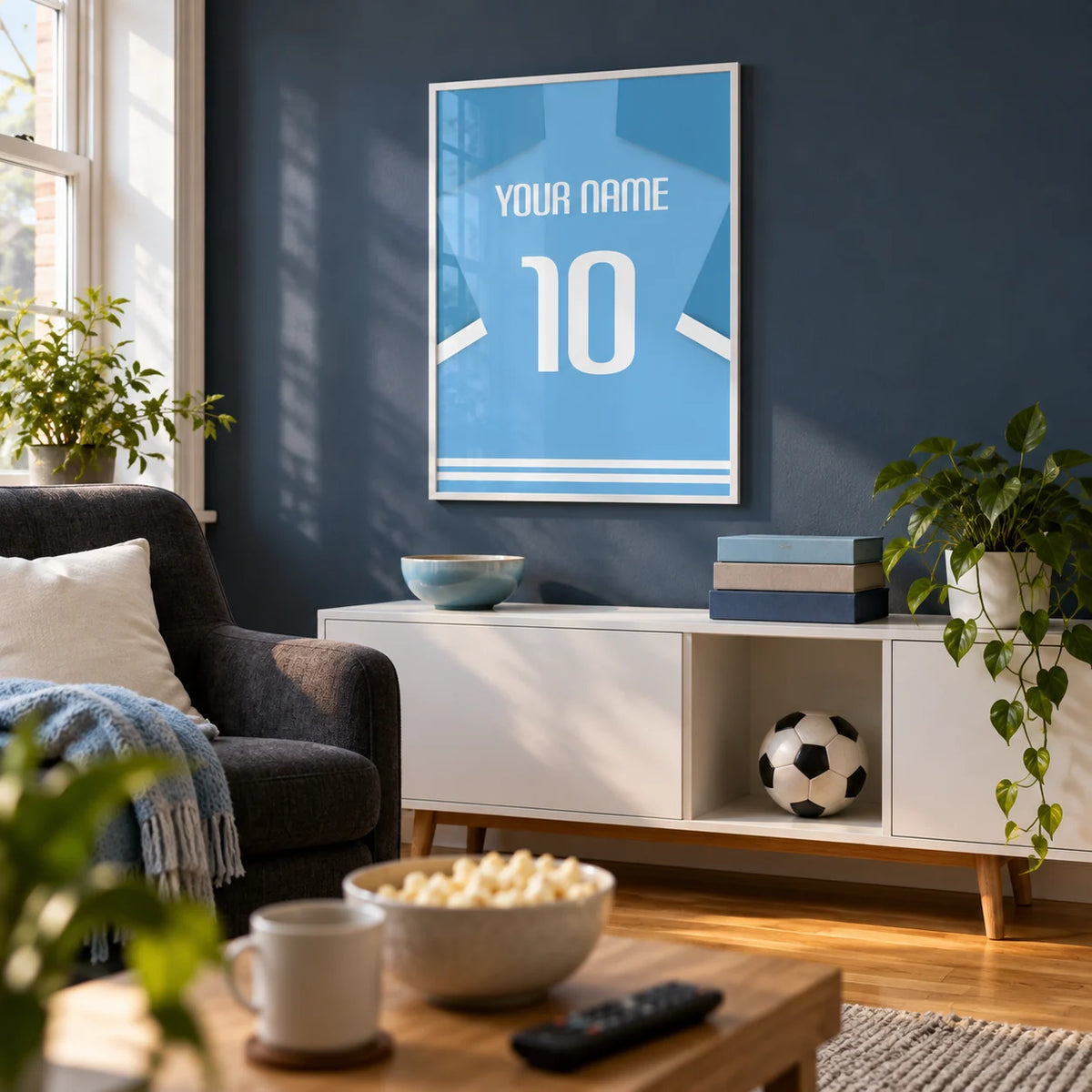 Football Shirt Poster in Light Blue with White Number, framed on the wall of a dedicated football watching snug in a UK terrace with a muted dark blue wall and warm oak floor in a living room
