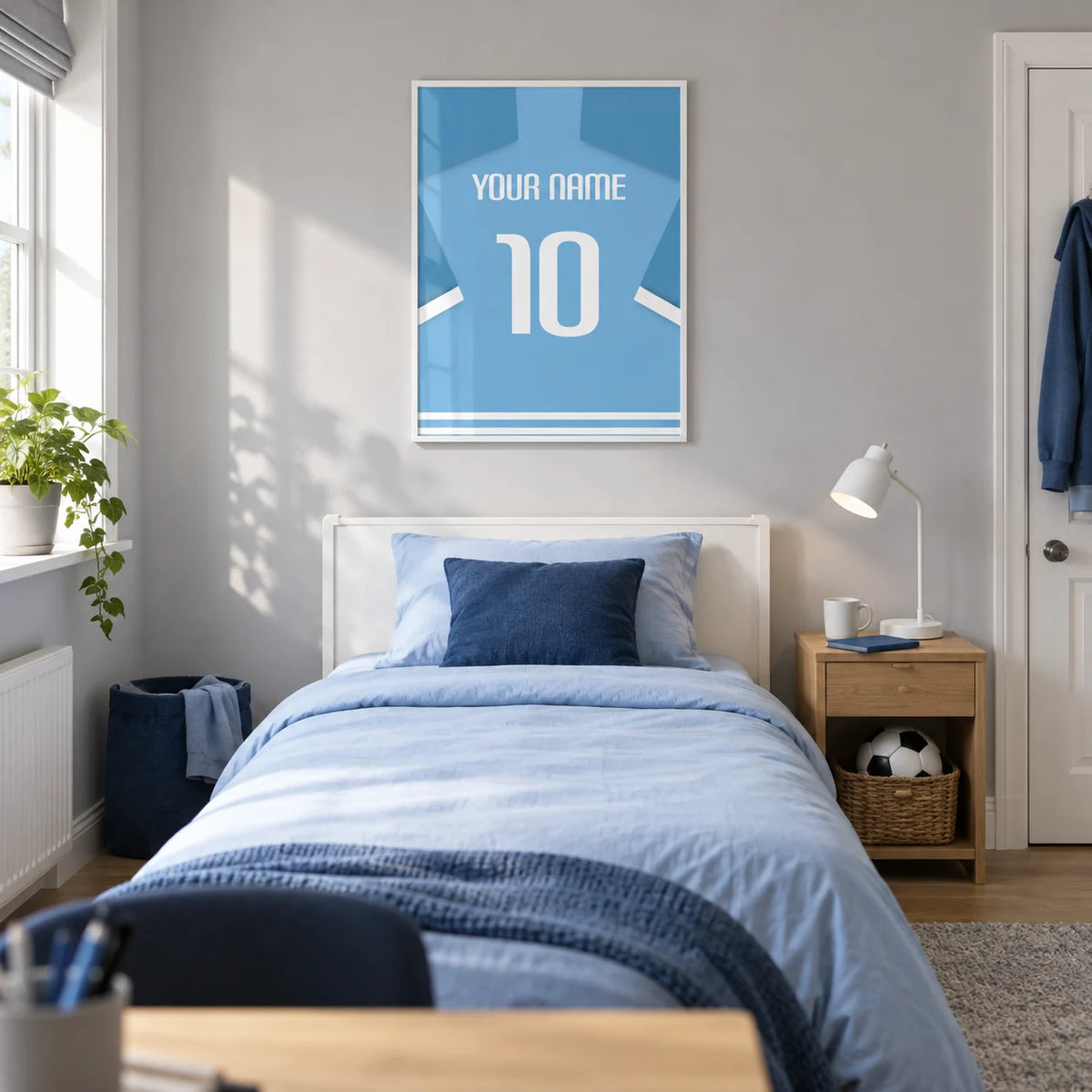 Football Shirt Poster in Light Blue with White Number, framed on the wall of a modern teenage football fan's single bedroom (13-17) in a UK family home with a pale grey wall and oak floor