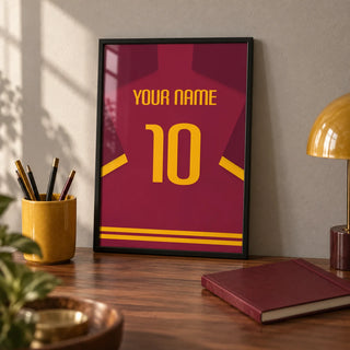 Football Shirt Poster in Maroon with Yellow Number, a small A4 framed print leaning on a walnut desk