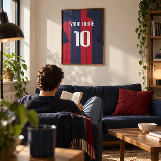 Football Shirt Poster in Navy and Red Stripes, framed on the wall of a compact modern living room in a football fan's first UK flat (22-28)