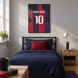 Football Shirt Poster in Navy and Red Stripes, framed on the wall of a modern football-loving teenager's single bedroom (13-17) in a UK family home with a pale grey wall and oak floor