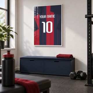 Football Shirt Poster in Navy and Red Stripes, framed on the wall of a small converted spare-room home gym in a UK house with a white wall and charcoal rubber flooring