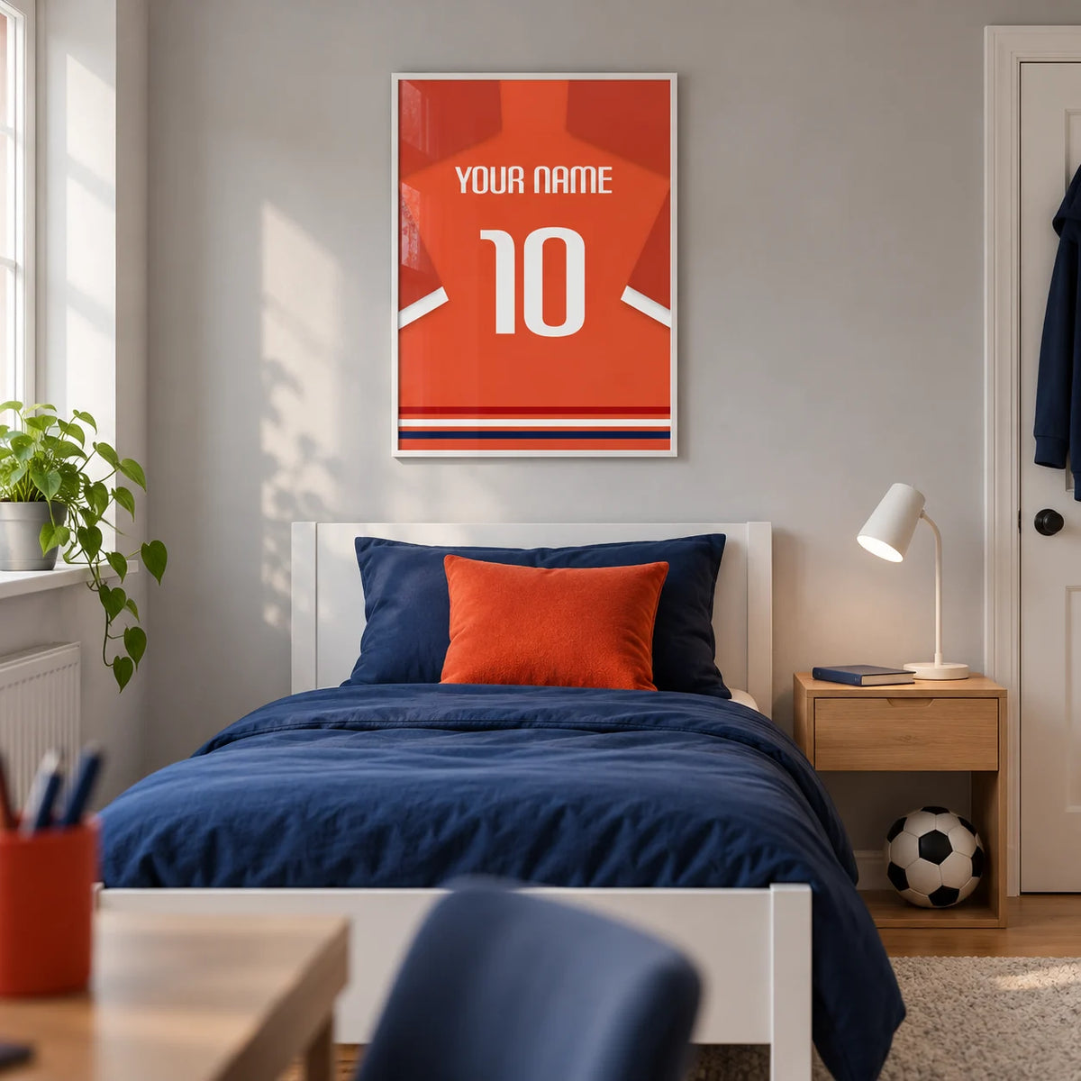 Football Shirt Poster in Orange-Red with White Number, framed on the wall of a modern football-loving teenager's single bedroom (13-17) in a UK family home with a pale grey wall and oak floor