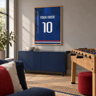 Football Shirt Poster in Plain Blue with White Number, framed on the wall of a contemporary games room in a UK family home with a warm grey wall and pale oak floor
