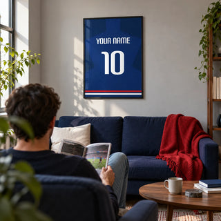 Football Shirt Poster in Plain Blue with White Number, framed on the wall of a modern football fan's living room in a first flat (22-28) with a pale grey wall and a low walnut coffee table