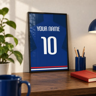Football Shirt Poster in Plain Blue with White Number, a small A4 framed print leaning on a walnut desk