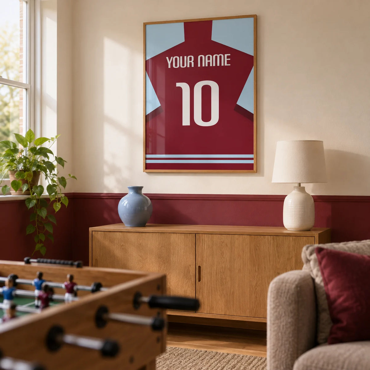 Football Shirt Poster in Plain Claret with White Number, framed on the wall of a football fan's small games snug in a UK family home with a warm white wall and a plain claret painted lower wall in a living room