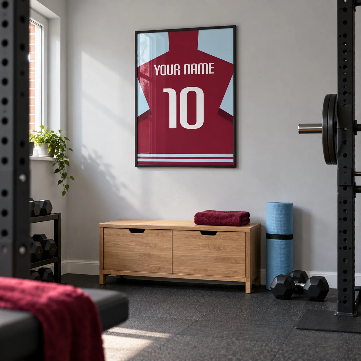 Football Shirt Poster in Plain Claret with White Number, framed on the wall of a neat converted garage home gym in a UK semi-detached house with light grey painted walls and charcoal rubber flooring