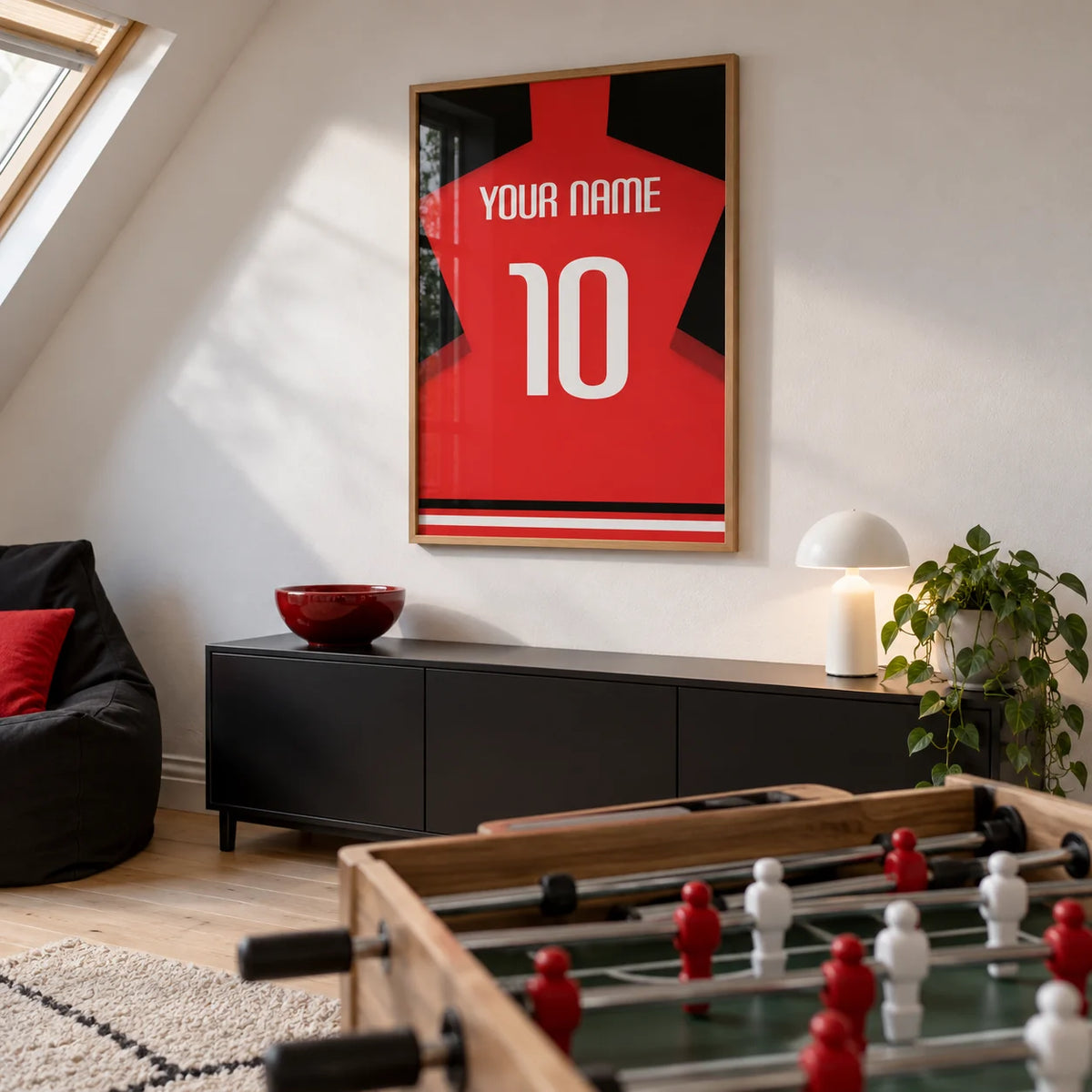 Football Shirt Poster in Plain Red with White Number, framed on the wall of a converted loft games room in a UK family home with a sloping ceiling
