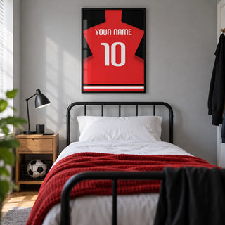 Football Shirt Poster in Plain Red with White Number, framed on the wall of a modern football-loving teenager's bedroom (13-17) in a UK family home with a pale grey wall