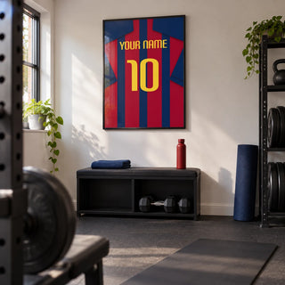 Football Shirt Poster in Red and Blue Stripes with Yellow Number, framed on the wall of a small converted garage home gym in a UK house with a clean off-white wall and charcoal rubber floor