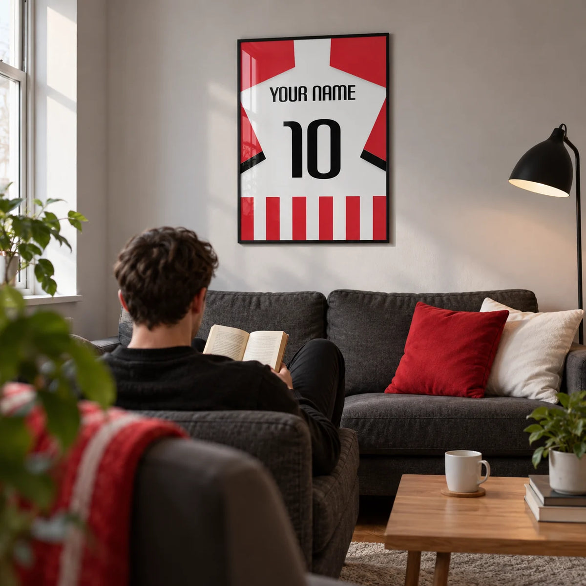 Football Shirt Poster in Red and White Stripes with Black Number, framed on the wall of a compact football supporter's lounge in a UK first flat (22-28)
